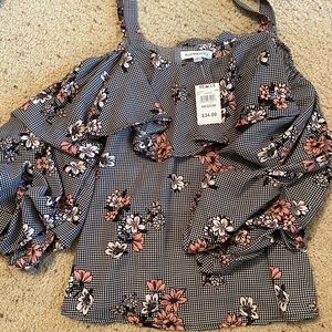 Black floral ruffle top